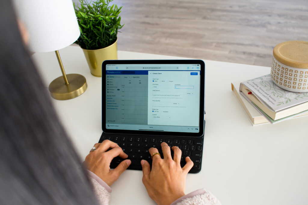 Postpartum mom filling out virtual therapy paperwork